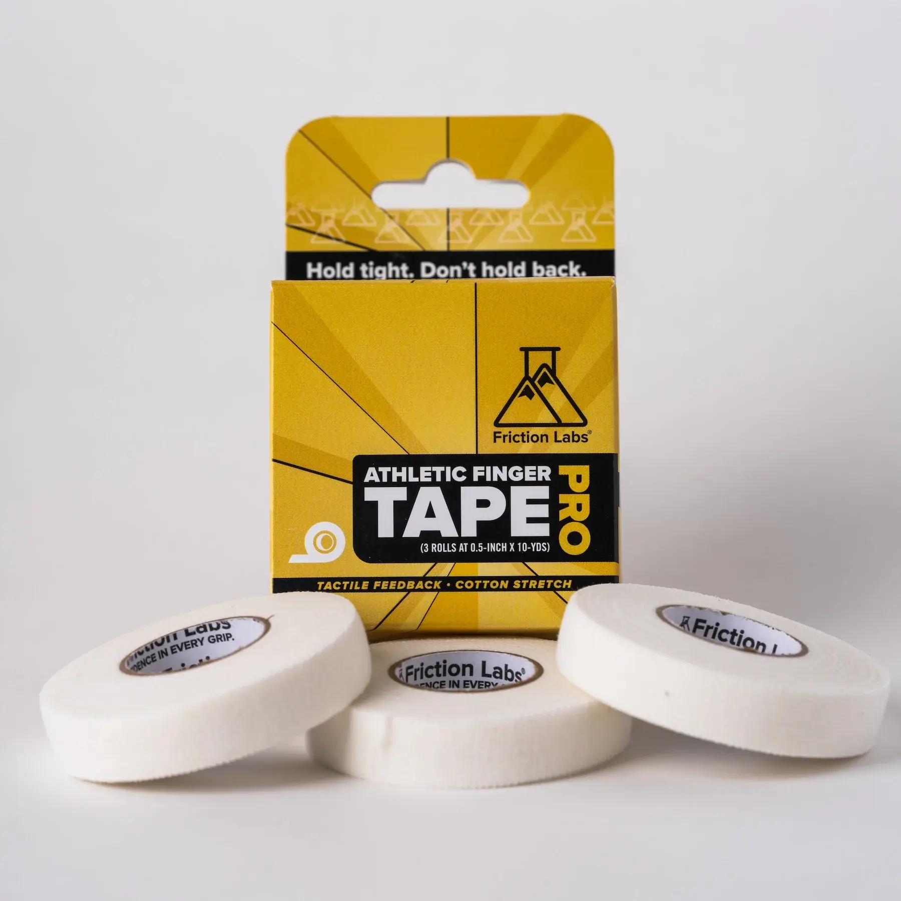 Before — finger tape box and rolls on grey backdrop